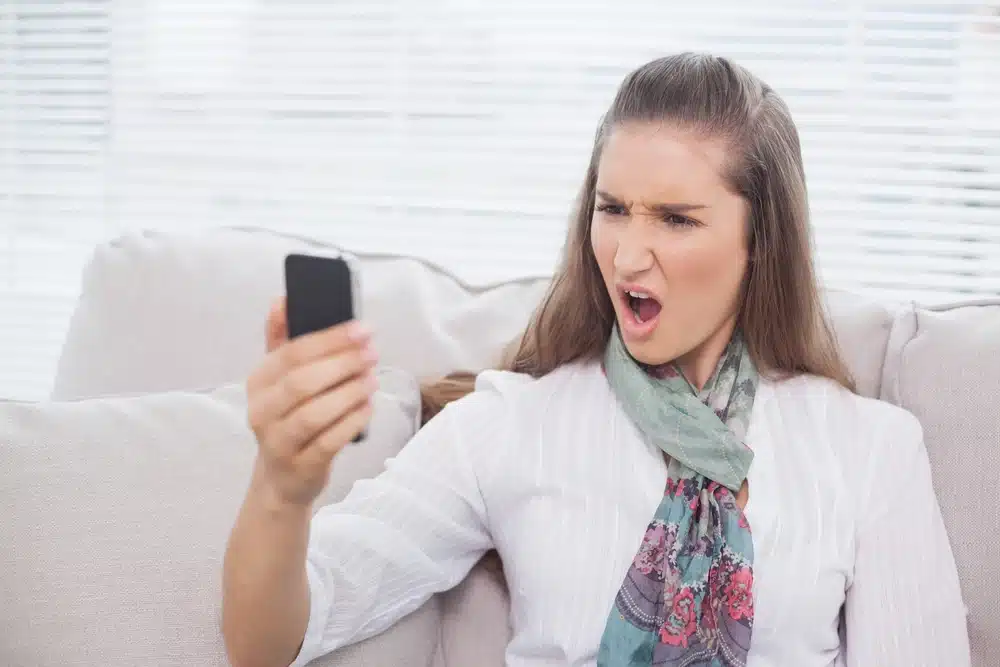 furious pretty model screaming on the phone
