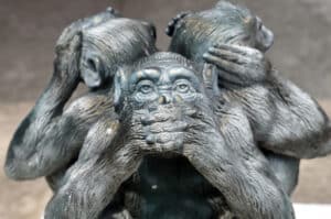 statue of three monkeys covering eyes, ears and mouth