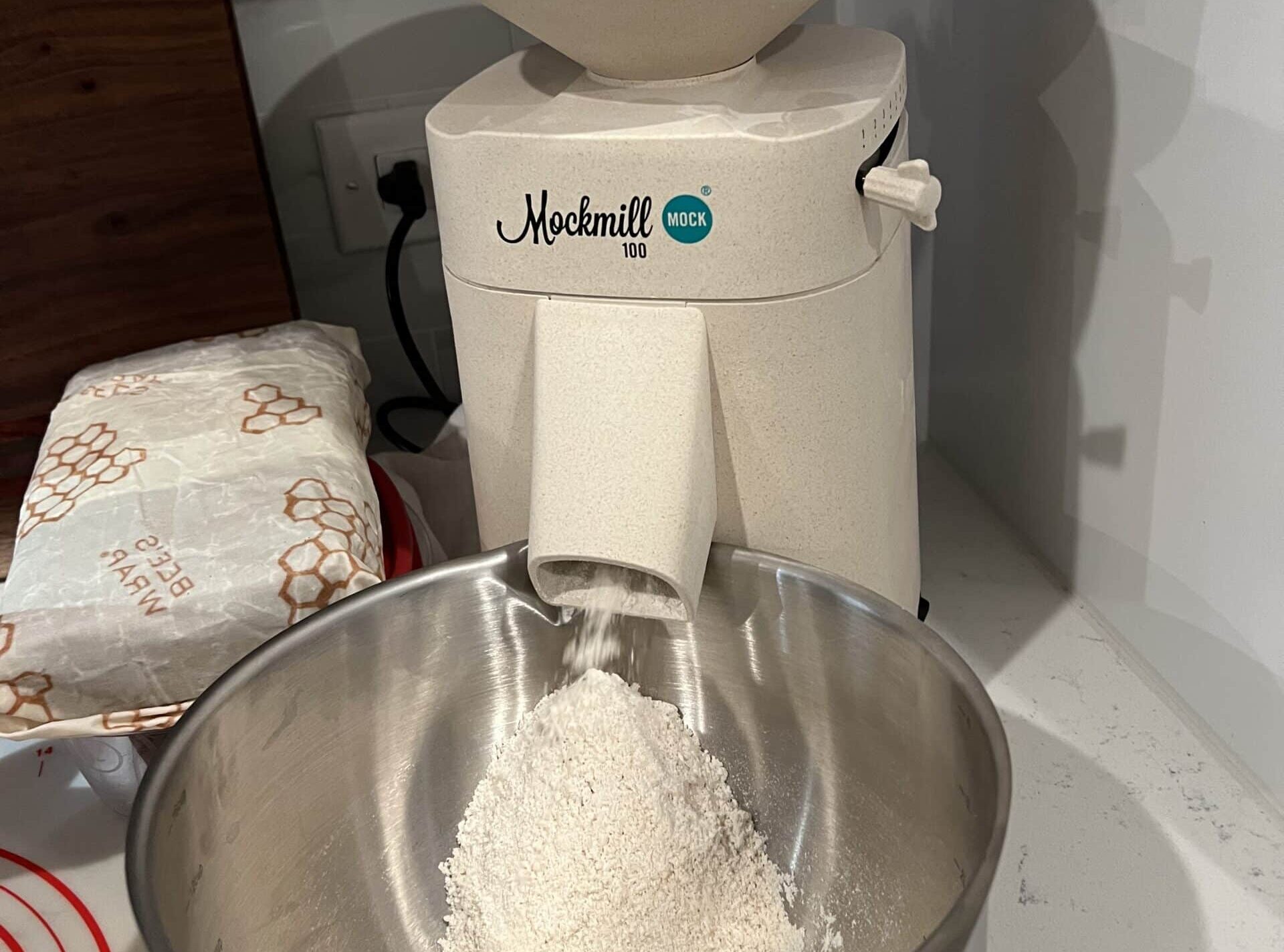 Mockmill 100 milling grain into fine flour
