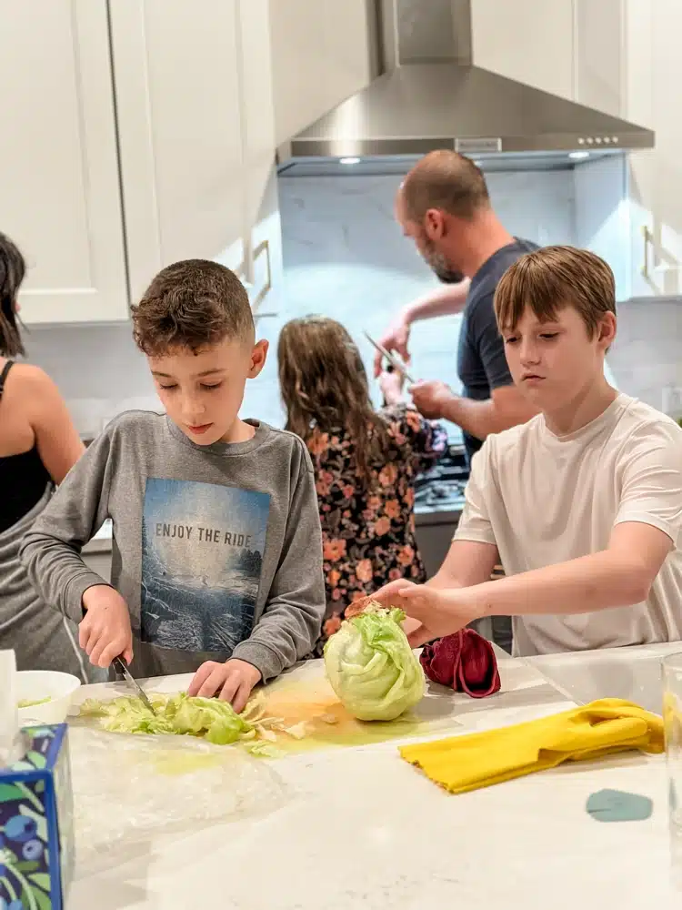large family meal planning blog image - kids chopping lettuce