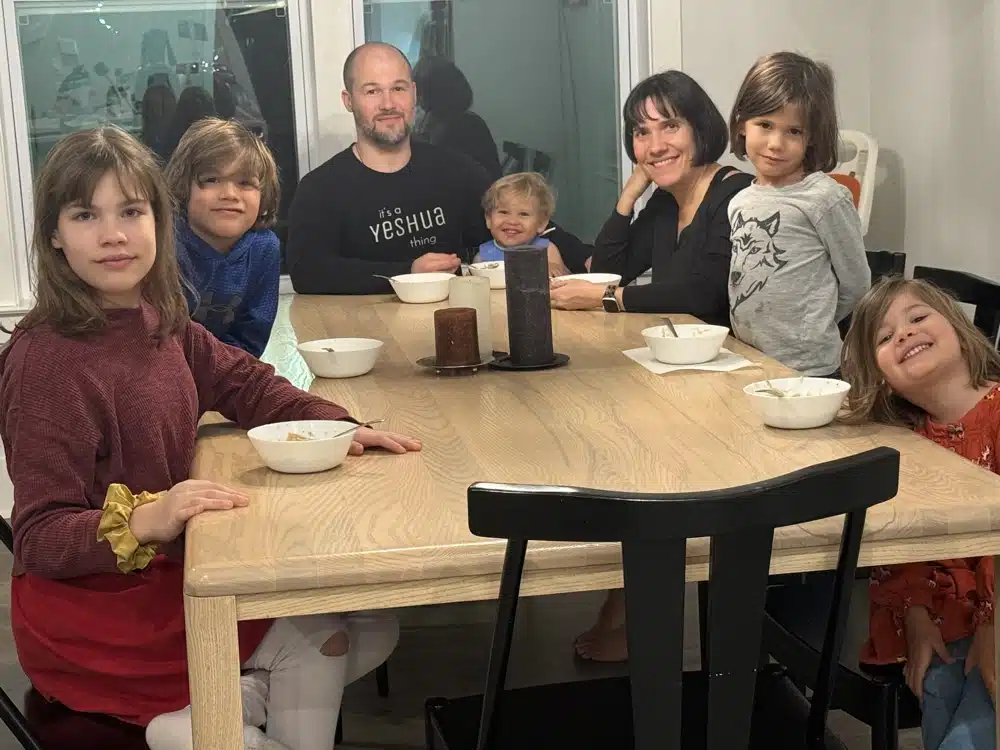 large family sitting around the dinner table