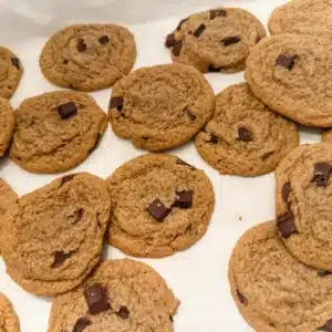 einkorn chocolate chip cookies spread out on parchment paper
